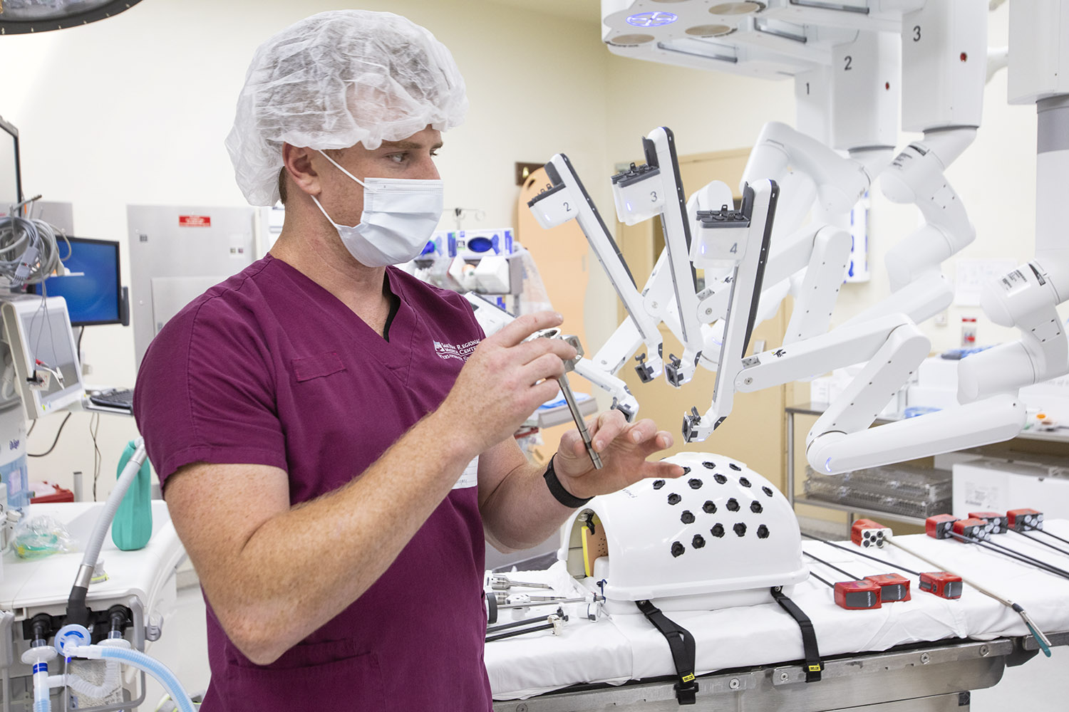Surgeon seated at the da Vinci Xi surgeon console during training